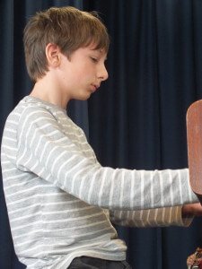 Young Boy Playing Piano at Concert