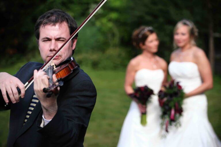 Violinist Simon Jordan and two brides